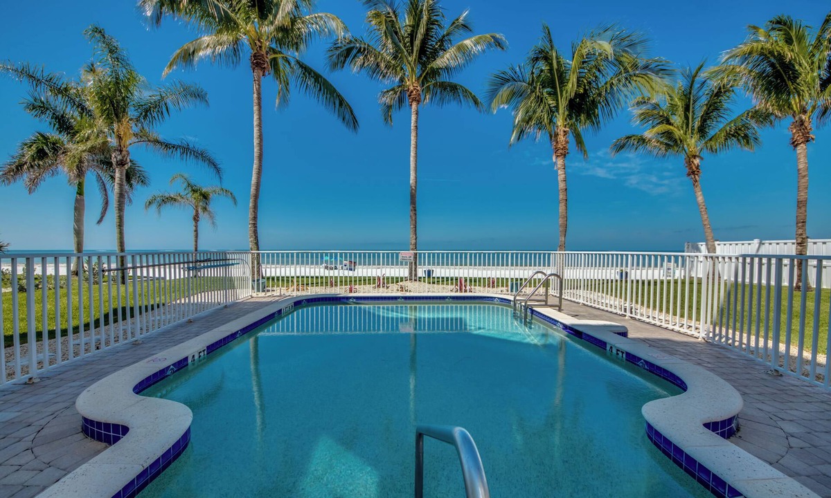 Mid Island House | 261 Key West - Luxurious Beachfront Home with Shared Pool!