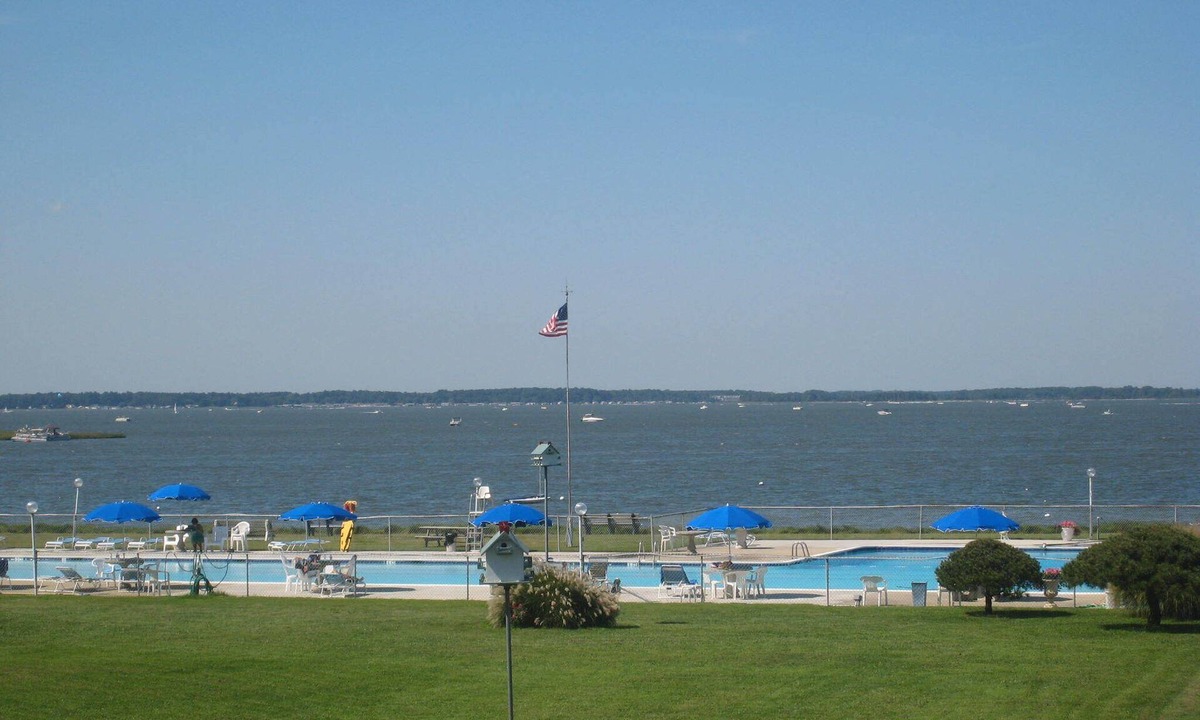 Ocean View Condo | Bethany Bayfront condo directly on the Bay large pool, open area, great Sunsets