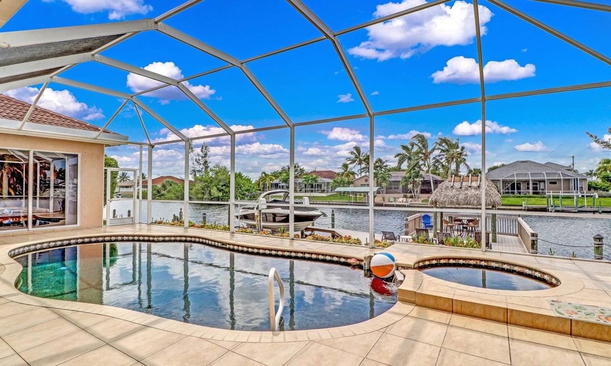 Pelican House | Blue Water 1022 Cape Coral Gulf Access Pool & Spa Home w/large Dock a. Tiki Hut