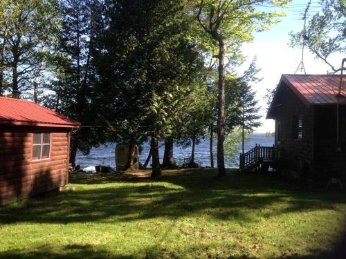Brownville House | Charming Lakefront Cabin Rental with a Fire Pit near Brownville, Maine