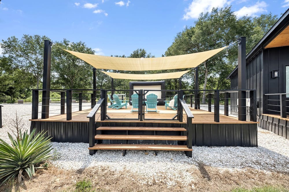 Waller Cabin | Charming Modern Farmhouse Tiny Home Retreat with Goats, Fishing Pond & Pool near Houston, Hempstead Texas