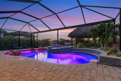 Burnt Store House | Heated Saltwater Pool & Spa with Tiki Hut - Backyard Oasis - Roelens