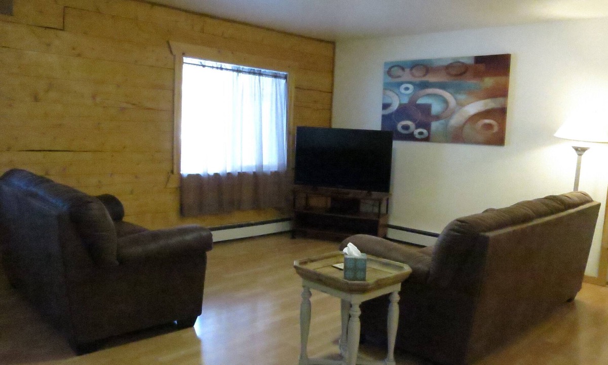 Moose Creek Apartment | Log 3-Bdr in Moose Creek among the birch and spruce trees
