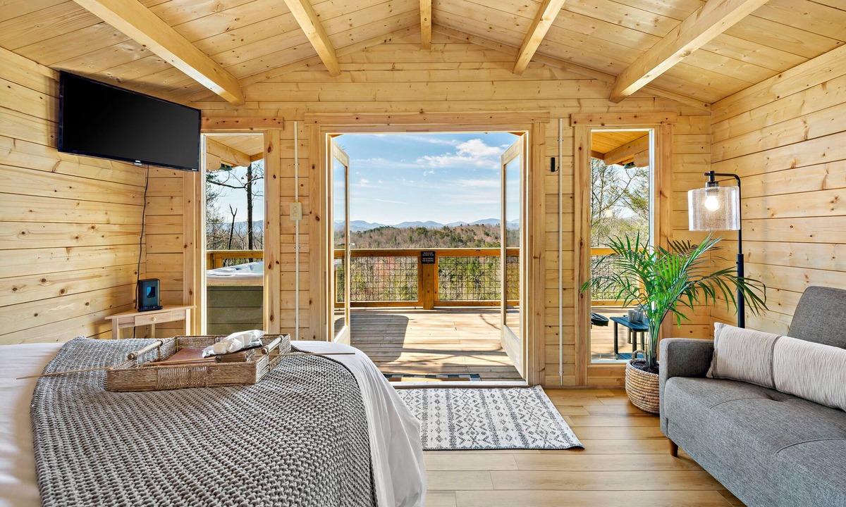 Old Fort Cabin | Romantic Treehouse with Hot Tub, Waterfall, Hiking, Swinging Bridge & Goats