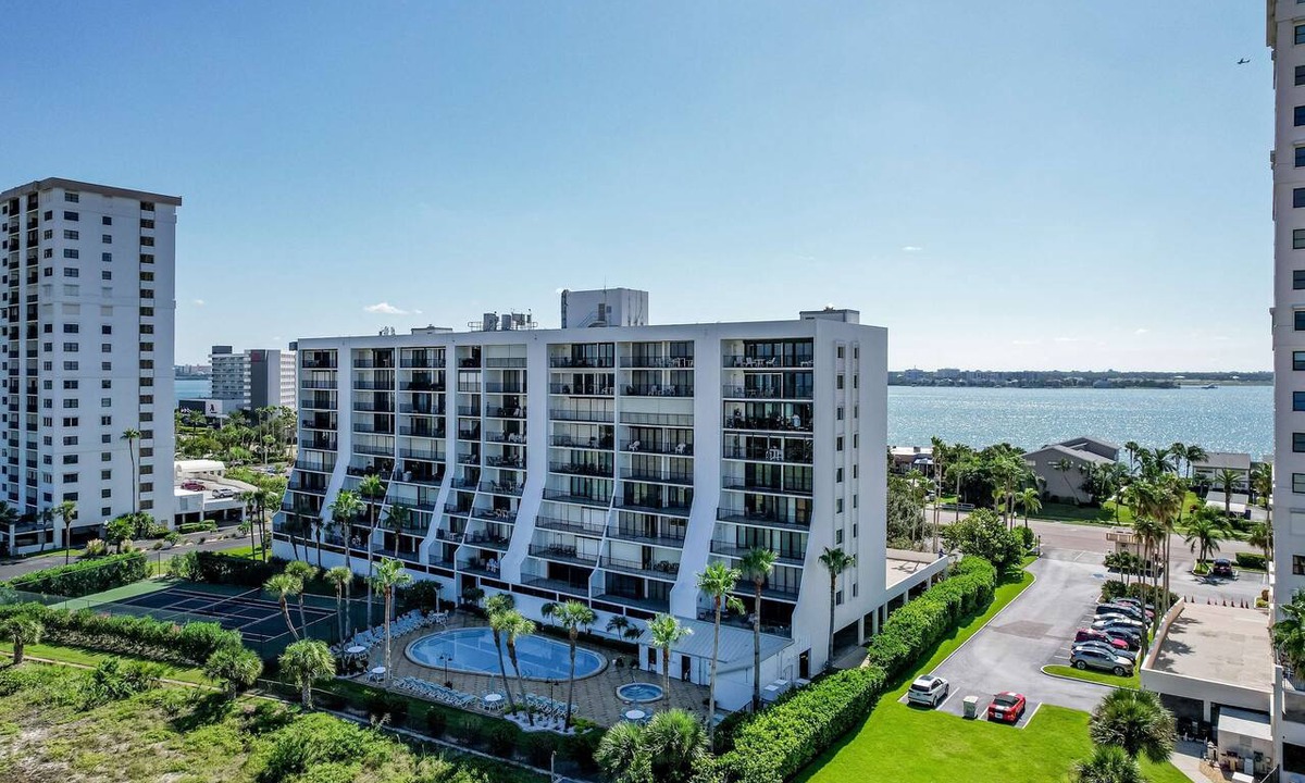 Sand Key House | Second floor condo with pool and tennis court private WD and central AC