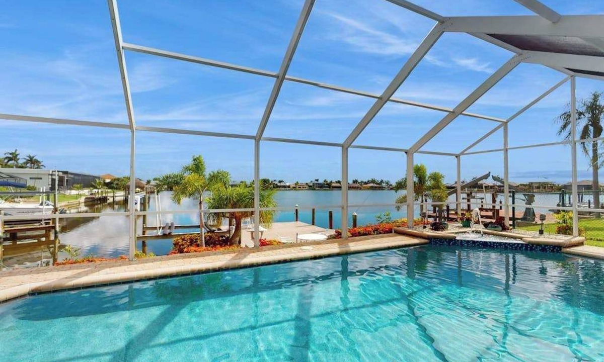 Eight Lakes House | Villa Aasta | Luxe Lakefront Outdoor Living | Screened Pool, Game Room & Dock