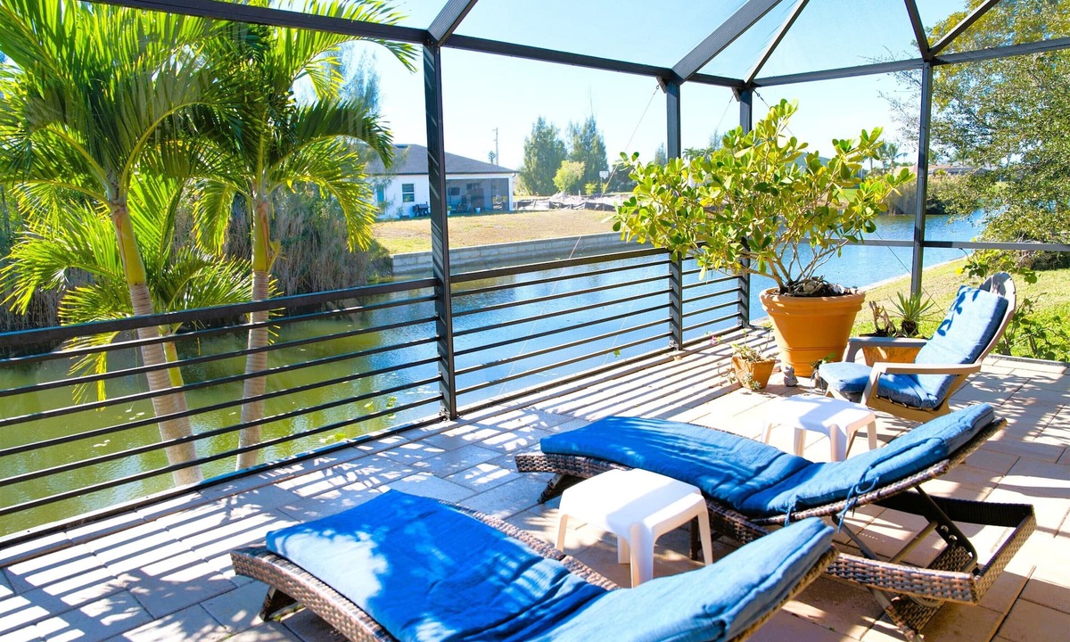 Cape Coral Villa | Waterfront home with oversized heated pool & spa, bikes, beach gear!