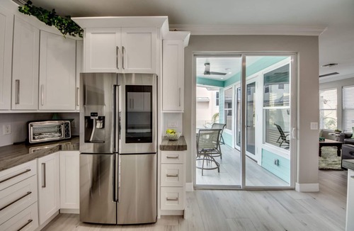 Mid Island House | 261 Key West - Luxurious Beachfront Home with Shared Pool!