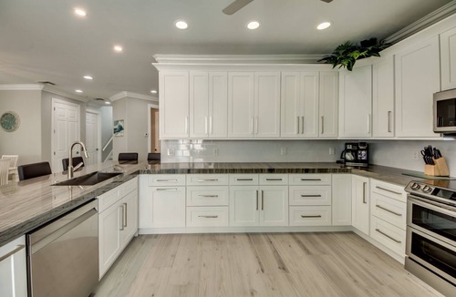 Mid Island House | 261 Key West - Luxurious Beachfront Home with Shared Pool!