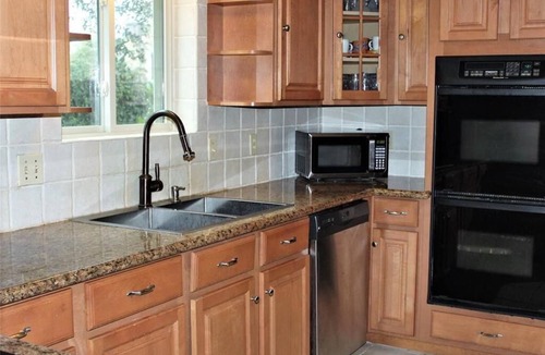 Briarforest House | Beautiful Three Bedroom Home with Scenic Backyard
