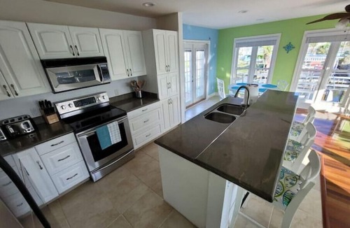 Matlacha House | Beautiful waterfront home with pool/spa, boat lift, kayaks and kayak launch!