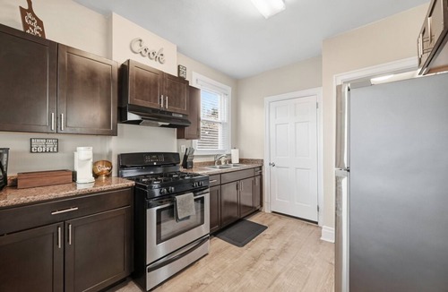 Brighton Heights Apartment | Bright 3BR near downtown with 2 private balconies, free parking, and a spotless, well-designed space. Easy access to stadiums, hospitals, and dining.