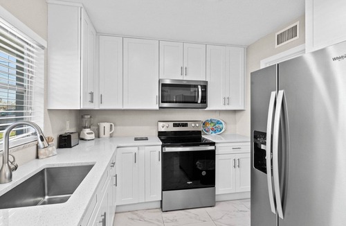 Yacht Club House | Casa Clara - 2 Bedroom, 2 Bath Vacation Home with Electric Heated Pool on Gulf Access Canal