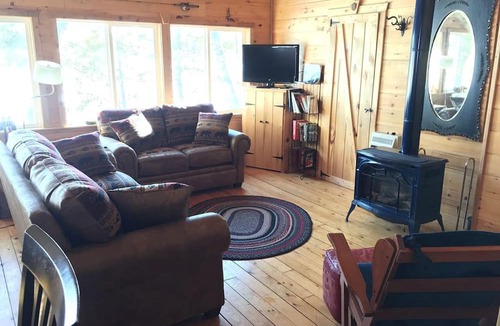 Brownville Cabin | Charming Lakefront Cabin Rental with a Fire Pit near Brownville, Maine