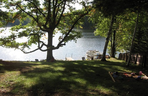 Evart Cottage | Charming Lakefront Cottage, Private Sandy Beach, Excellent Fishing