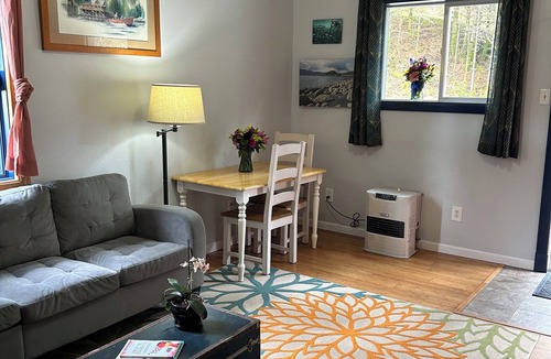 Kodiak Cottage | Cozy, quiet cottage surrounded by large spruce trees and Mountain View’s.