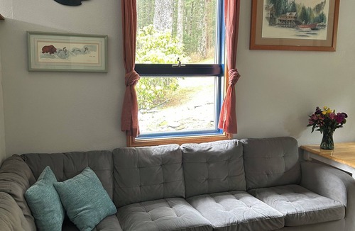 Kodiak Cottage | Cozy, quiet cottage surrounded by large spruce trees and Mountain View’s.