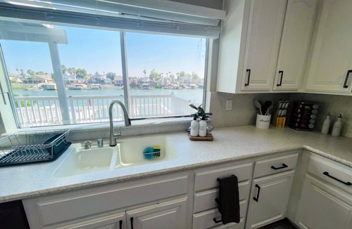 Discovery Bay House | DiscoBay Waterfront Getaway w/Game Room, Video Games, Deck & Water toys