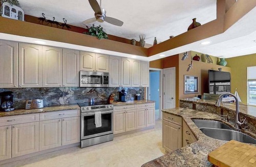 Matlacha Isles House | Dog-friendly waterfront home with heated pool, lanai, central AC, & W/D