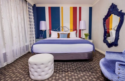 Theater District Hotel | Enjoy Romantic Getaway at French-Style Room w/Cozy Ambience & Central Location
