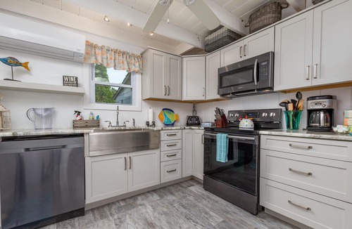 Rehoboth by the Sea Cottage | Enjoy the screened in porch just steps from the beach.