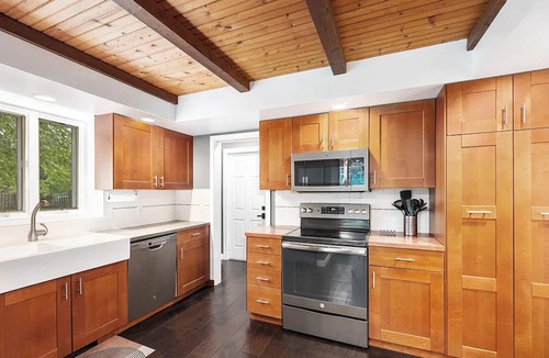 Ada House | Escape to a 4BR/2Bath wooded retreat just minutes from Grand Rapids.