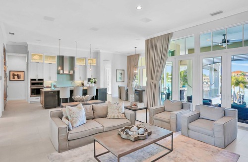 Island Estate House | Exquisite Clearwater Retreat w Heated Pool Game Room Outdoor kitchen and Kayaks