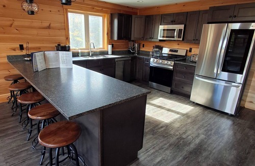 Carrabassett Valley Cabin | Gorgeous dog-friendly cabin with great view, deck, hot tub, & gas fireplace