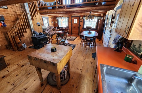 The Forks Cabin | Gorgeous log cabin overlooking the Dead River just north of Berry's Store Rt 201