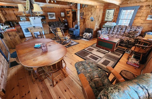The Forks Cabin | Gorgeous log cabin overlooking the Dead River just north of Berry's Store Rt 201