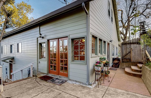 Black Point-Green Point House | Gorgeous river view home with wood stove, sauna, patio, fitness room, & kitchen
