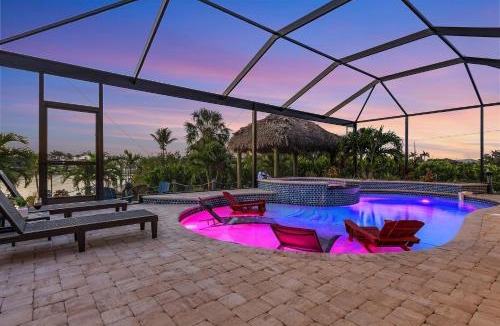 Burnt Store House | Heated Saltwater Pool & Spa with Tiki Hut - Backyard Oasis - Roelens