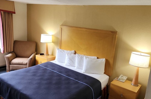 Sherman Station Apartment | King hotel suite with living room, large fridge/freezer in Millinocket, Maine