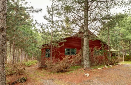 Greenville Junction House | Lakefront Home with Private Dock, Pebble Beach & Enclosed Porch - Dogs Welcome