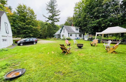 Brighton House | Lakeview Farmhouse with private beach access and on snowmobile VAST trail.