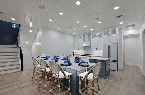 Whitney Beach House | Luxe Waterfront Canal Home w Heated Pool & Spa Rooftop Deck Outdoor Kitchen Golf