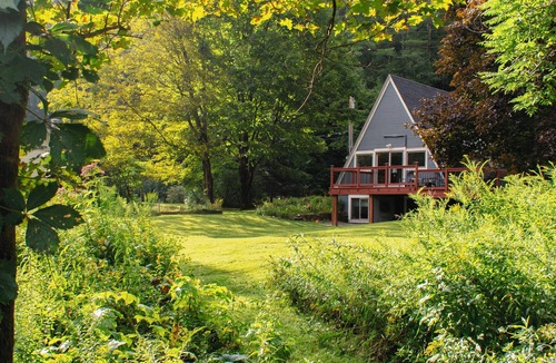 Waterbury House | On the River A-Frame. Cozy 4 season river, lake and ski retreat.