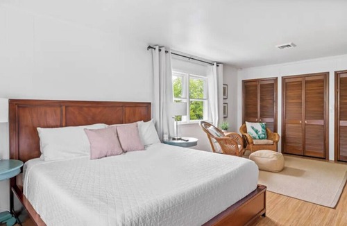 Rehoboth Beach Hotel | Palm Tree Room — Elegant British Colonial Luxury with Spacious Comfort