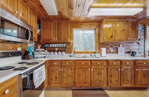 Otis House | Peaceful Lakefront Escape with Outdoor Dining, Beach Access, Deck & Firepit