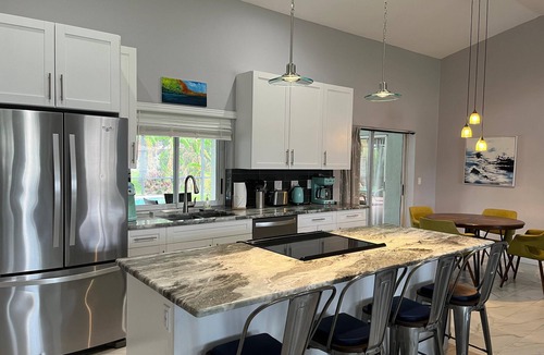 Pelican House | Private Tropical Oasis Heated Pool Outdoor Living Perfect Family Vacation
