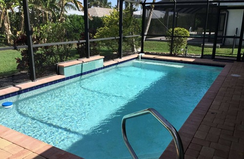 Pelican House | Private Tropical Oasis Heated Pool Outdoor Living Perfect Family Vacation