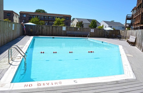 Caine Woods Condo | Quaint, but pristine 2-bedroom condo with free WiFi and an outdoor pool located uptown on the bayside in a peaceful, family-friendly neighborhood!