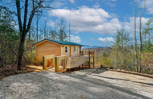 Old Fort Cabin | Romantic Treehouse with Hot Tub, Waterfall, Hiking, Swinging Bridge & Goats