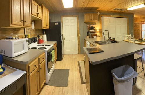 New Rumley Cabin | Rustic Cabin Retreat on 120 Acres with Private Lake, Wildlife, and Fireplace.