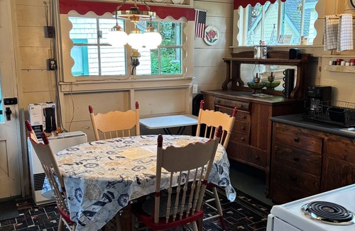 Bayside Cottage | Rustic cottage a block from the water at 19 Broadway, Bayside, Northport