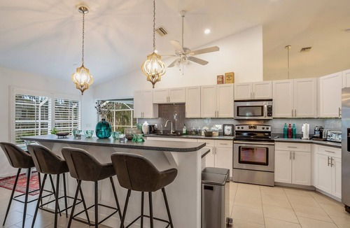 Burnt Store House | SEASIDE COTTAGE - Southern fenced yard, tropical fruit trees, pool, contemporary