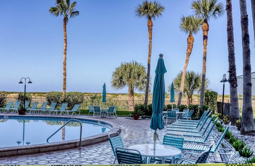 Sand Key House | Second floor condo with pool and tennis court private WD and central AC