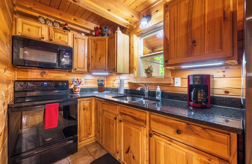 New Plymouth Cabin | Spacious Log Cabin with Hot Tub, Fire Pit, Large Decks & Wood Fireplace