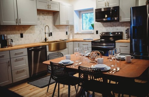 College Cabin | This beautiful log cottage has large windows that let in lots of light