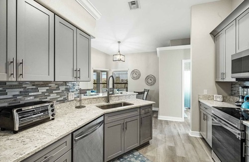 Mariner House | Tropical Gem! Sparkling Saltwater Pool Peaceful Canal with Dock Luxe Comfort